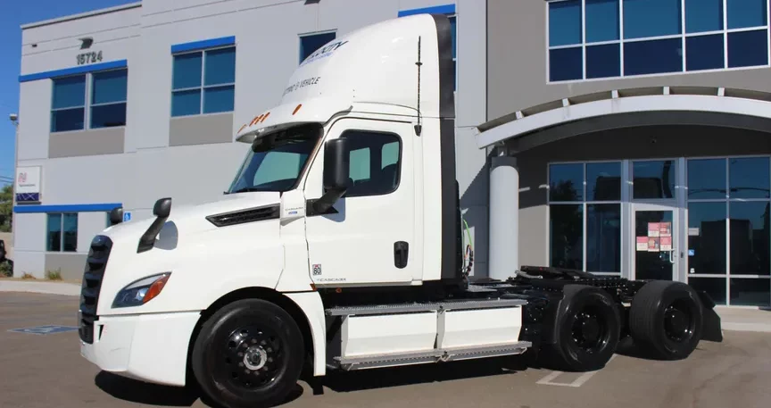 Velocity-EV-truck-parked-in-front-of-office